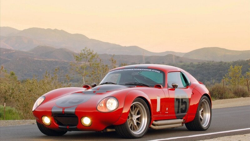Red race car on mountain road
