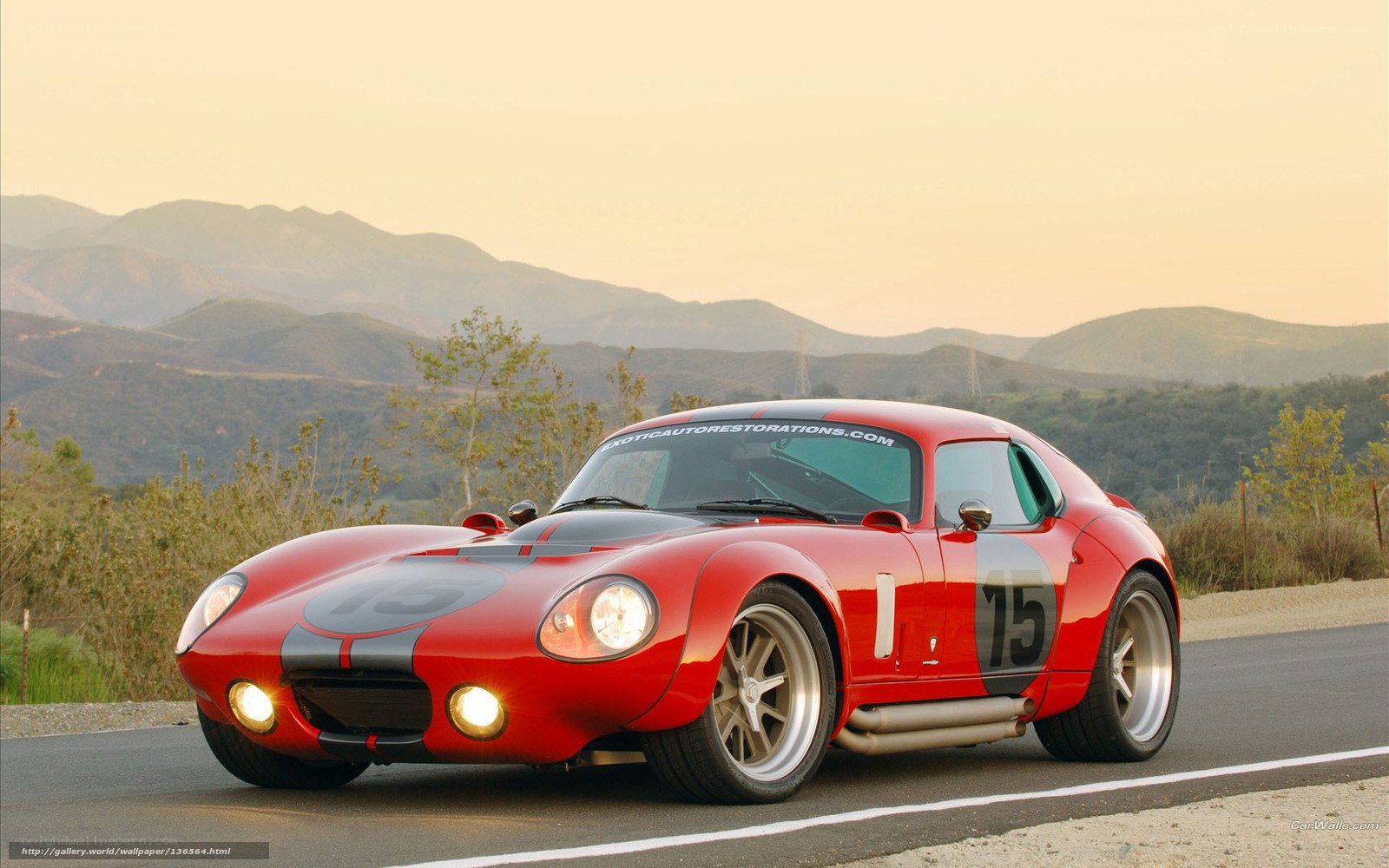 Red race car on mountain road