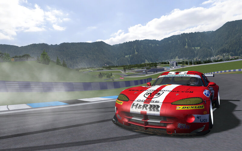 Red race car on mountain track
