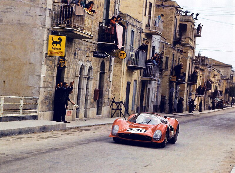 Red Race Car on Street — Orange