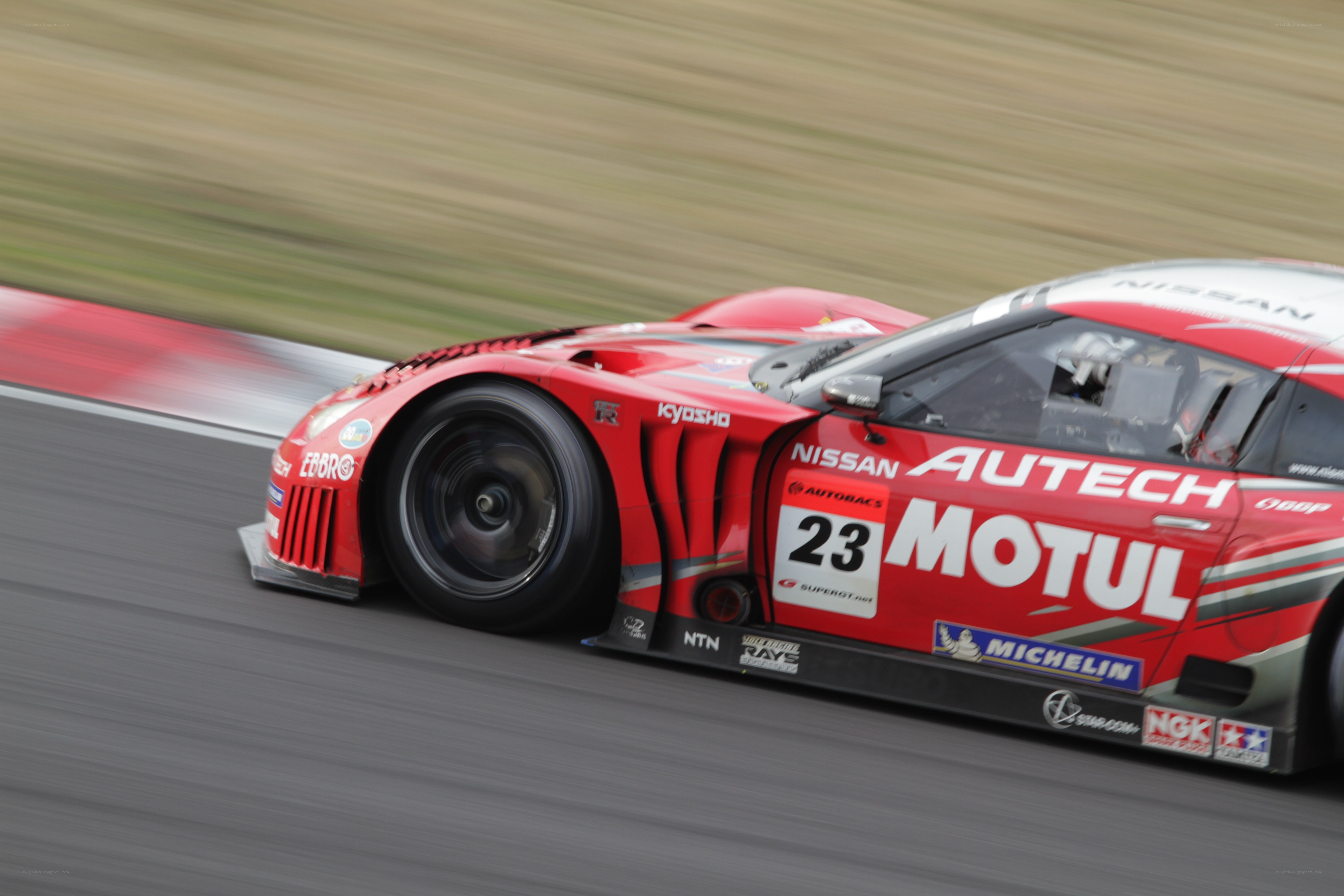 Red race car on track