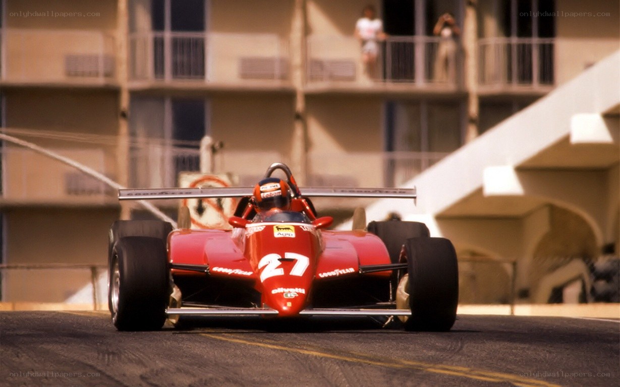 Red race car on track