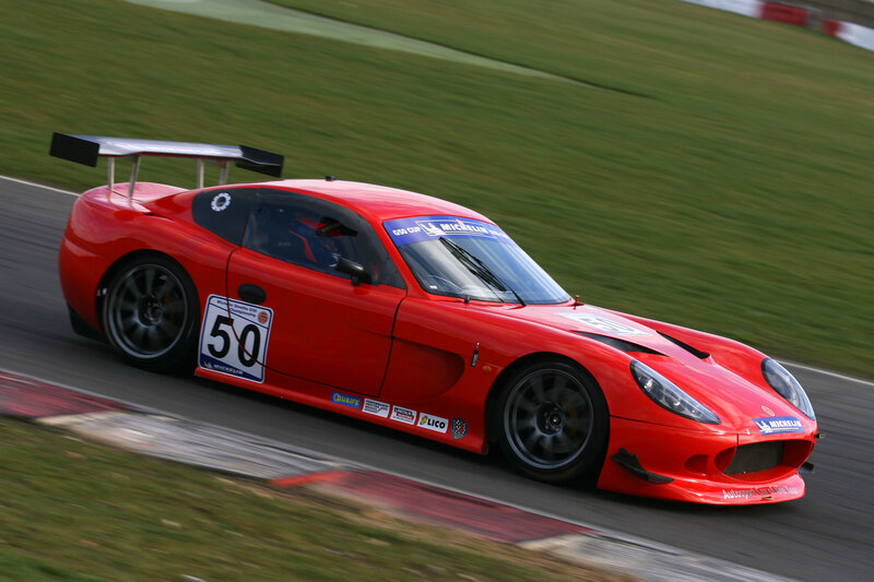 Red race car on track