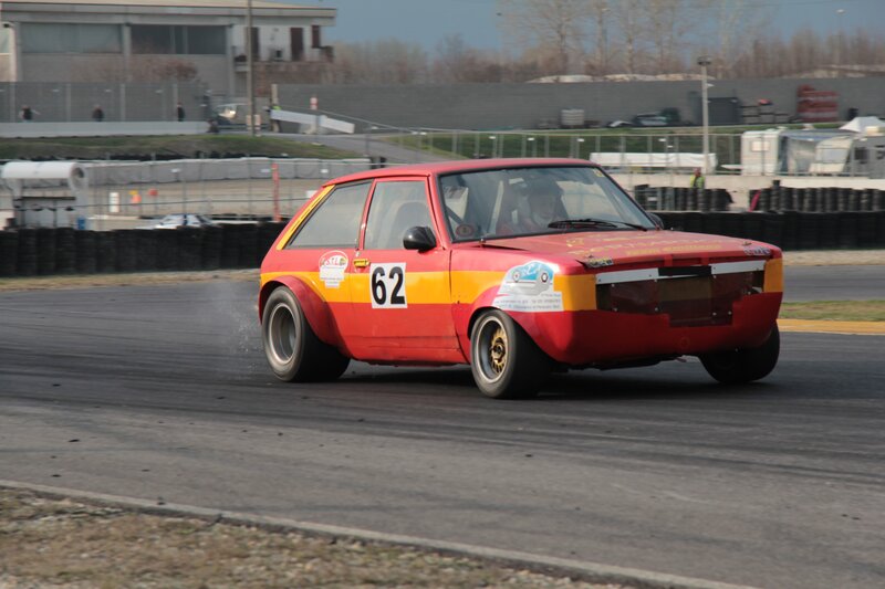 Red race car on track