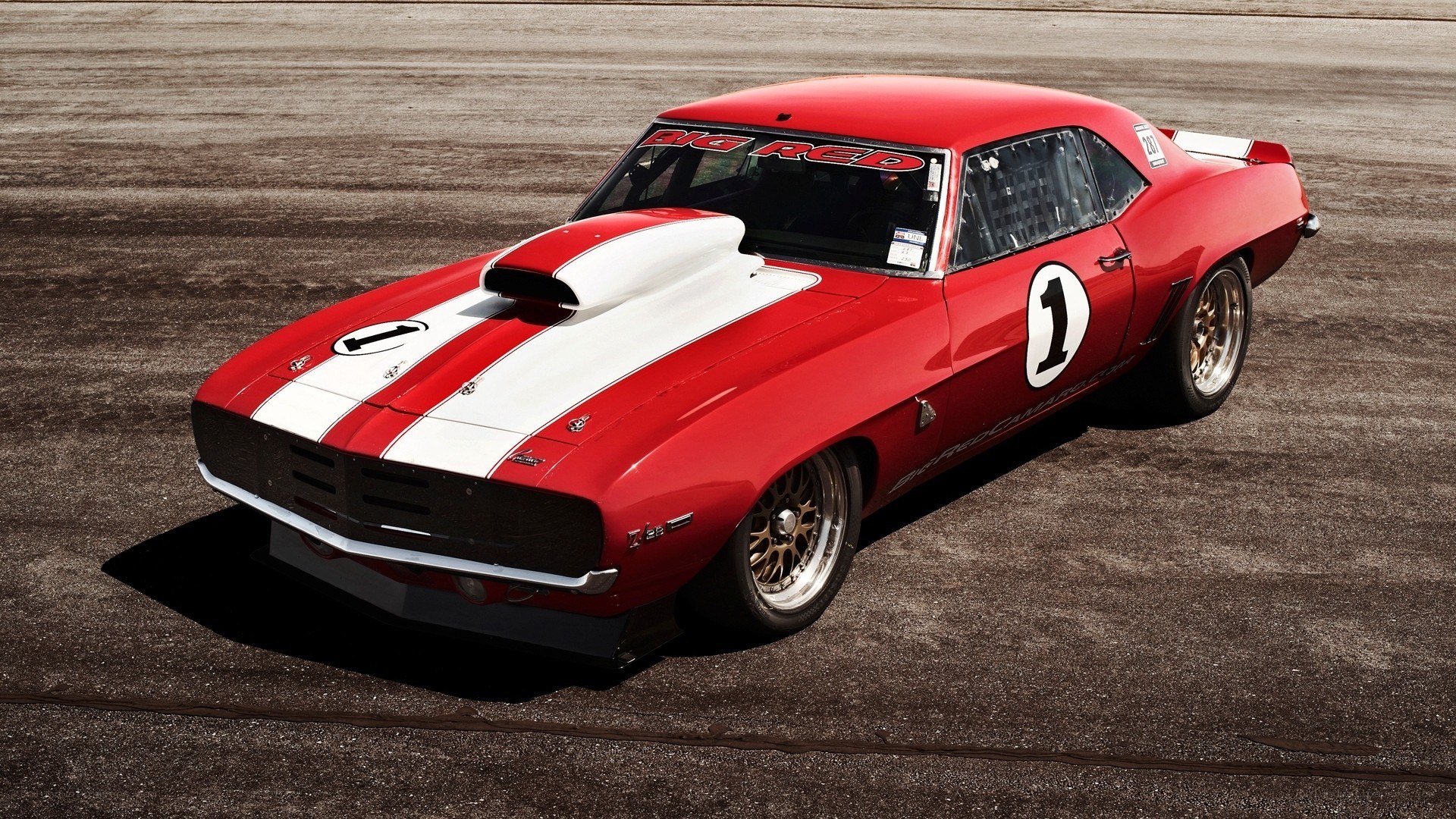 Red race car on track