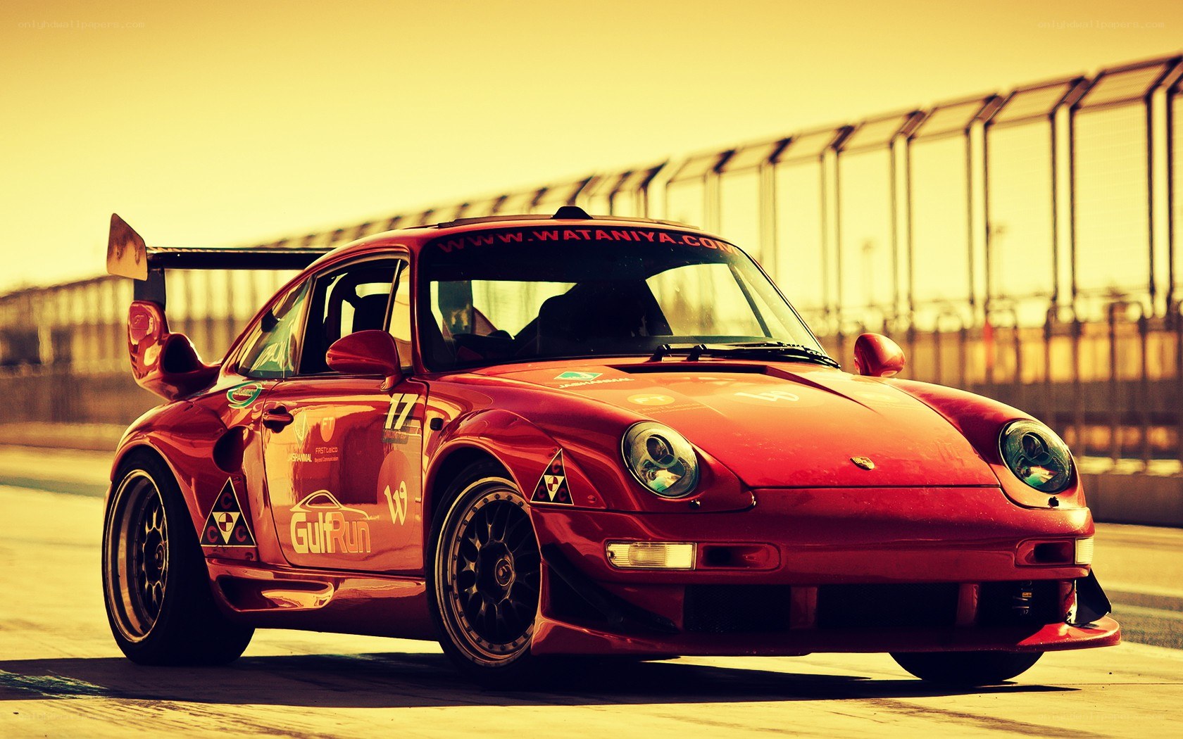 Red race car on track