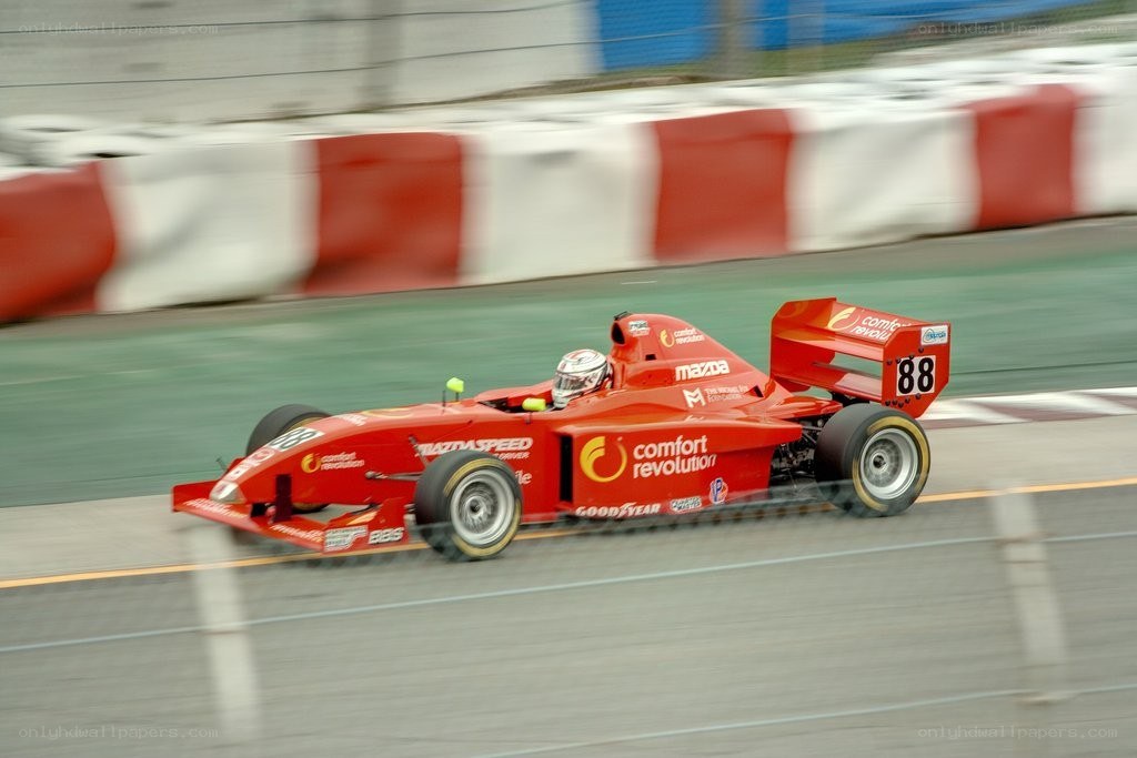 Red race car on track