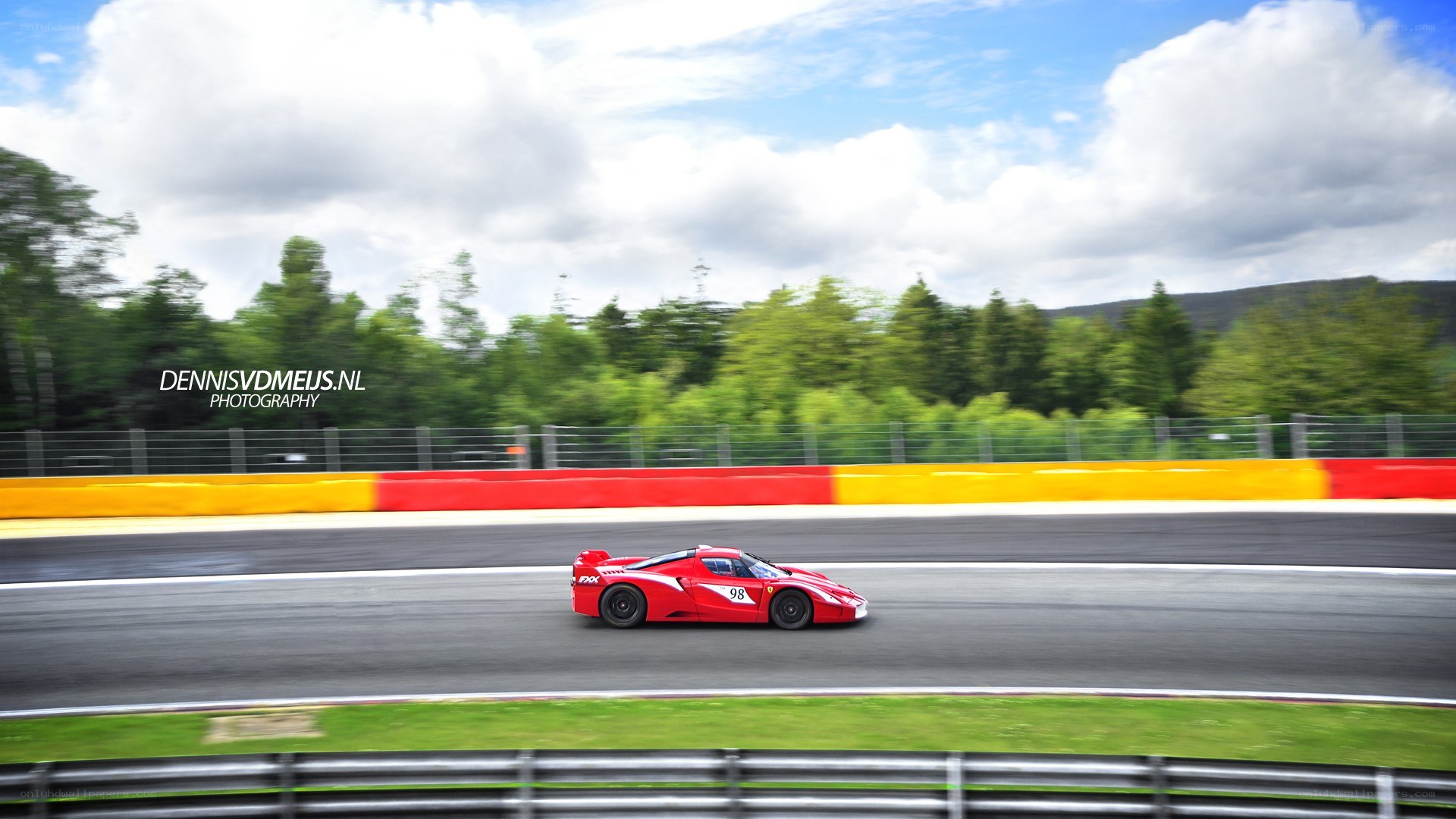 Red race car on track