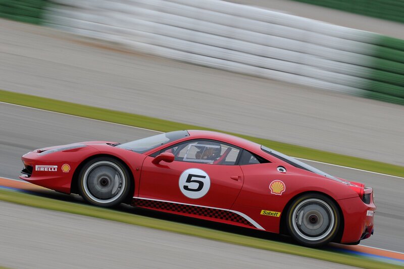 Red race car on track