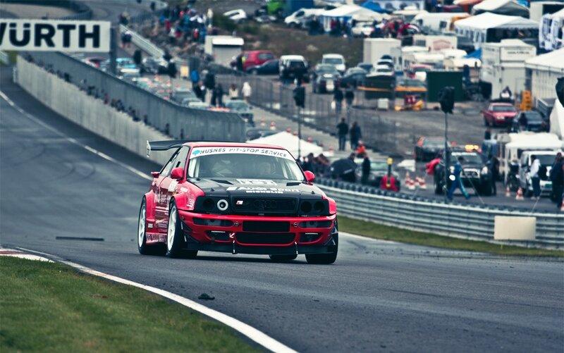Red race car on track
