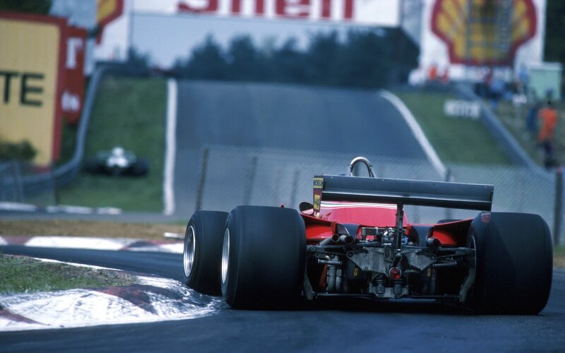 Red race car on track