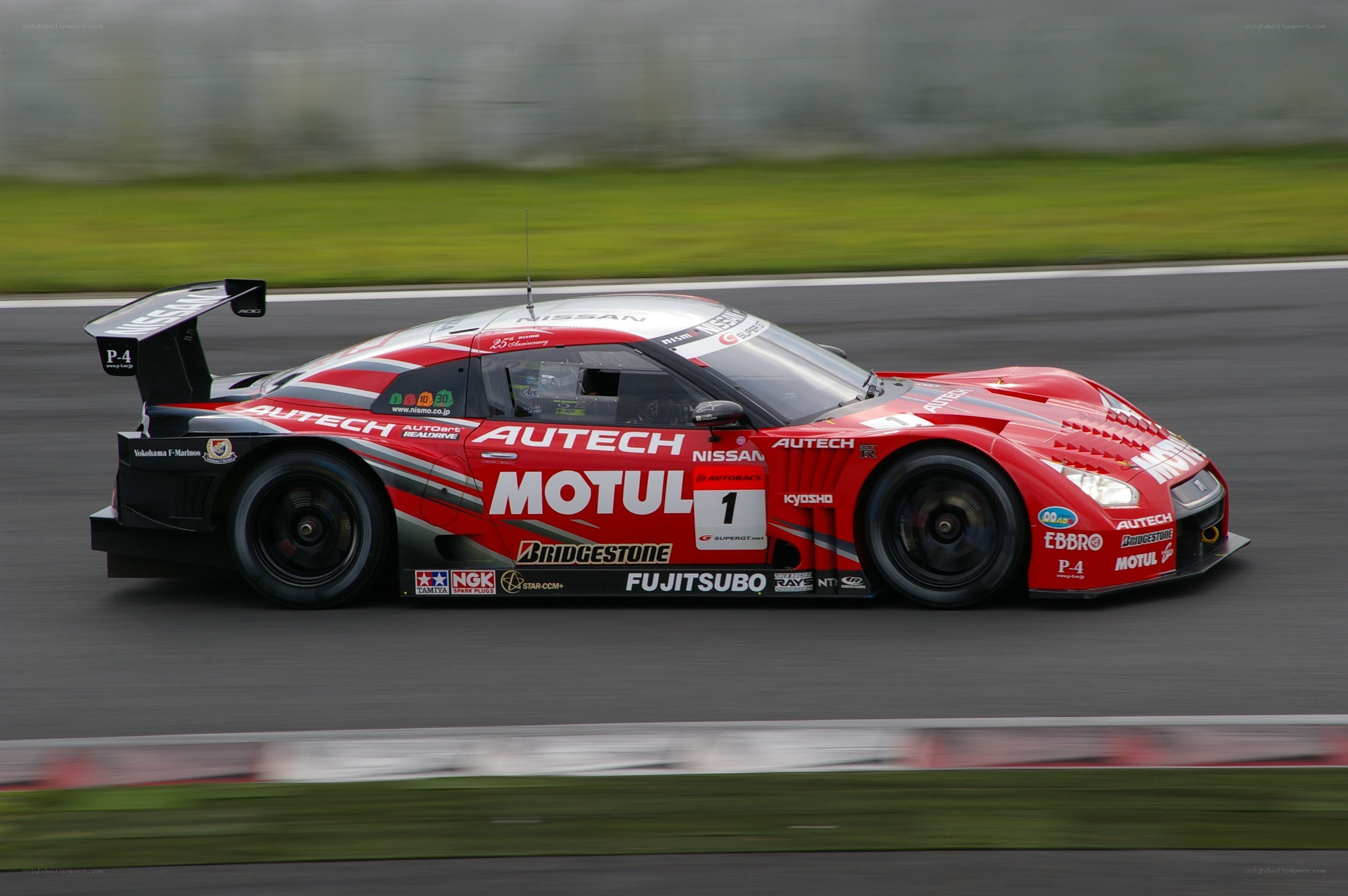 Red race car on track