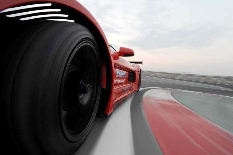 Red race car on track