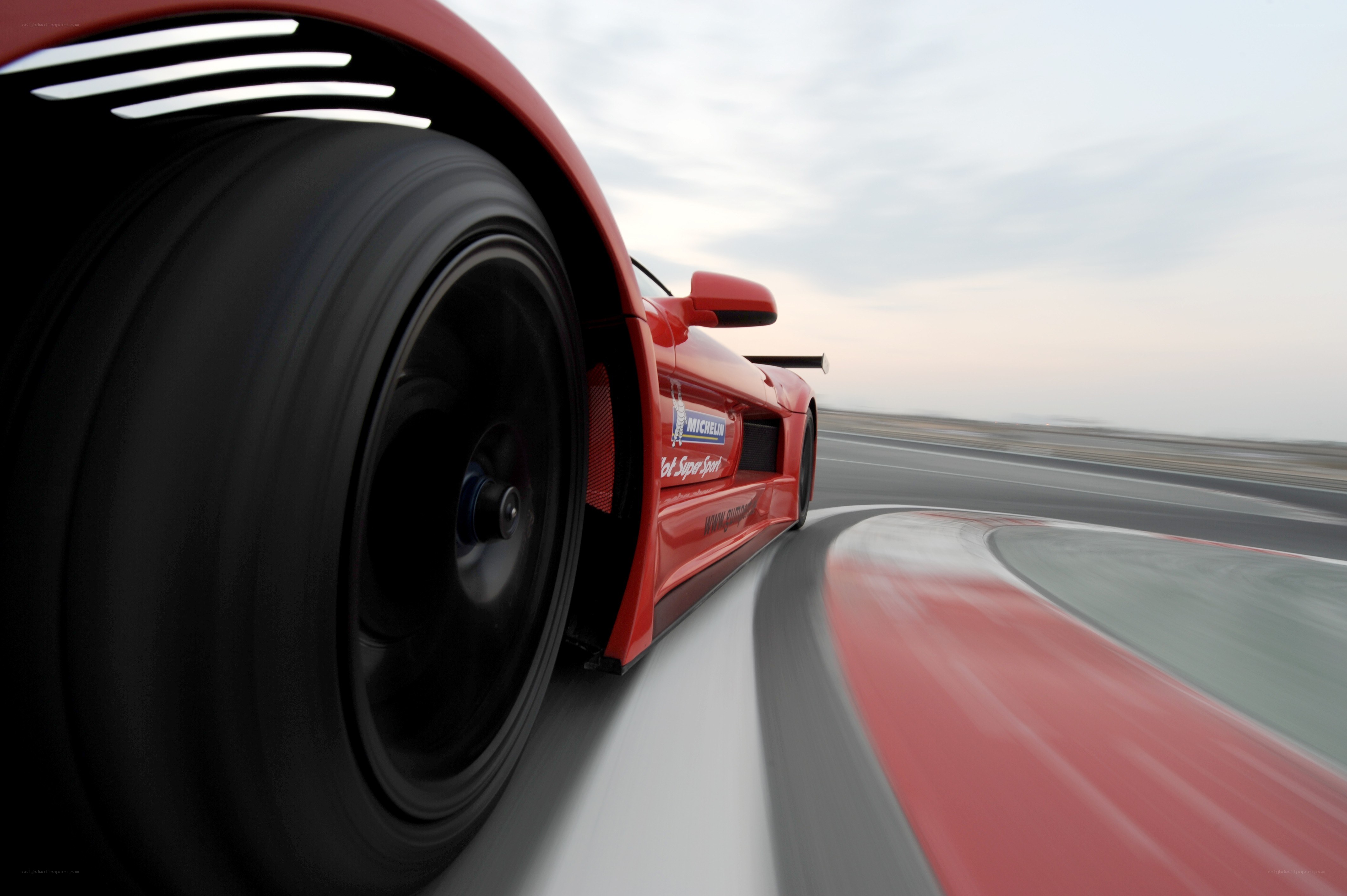 Red race car on track