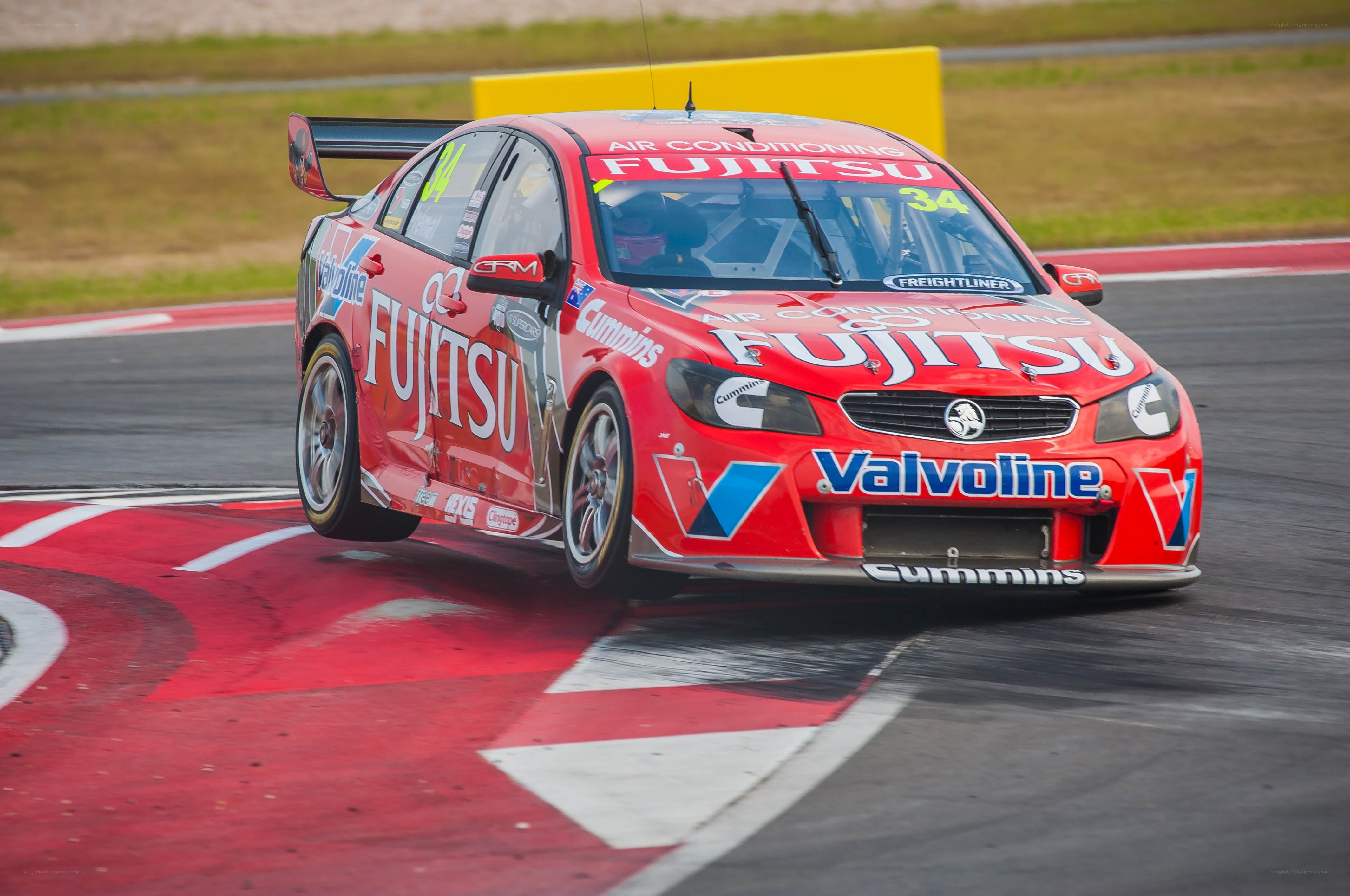 Red race car on track