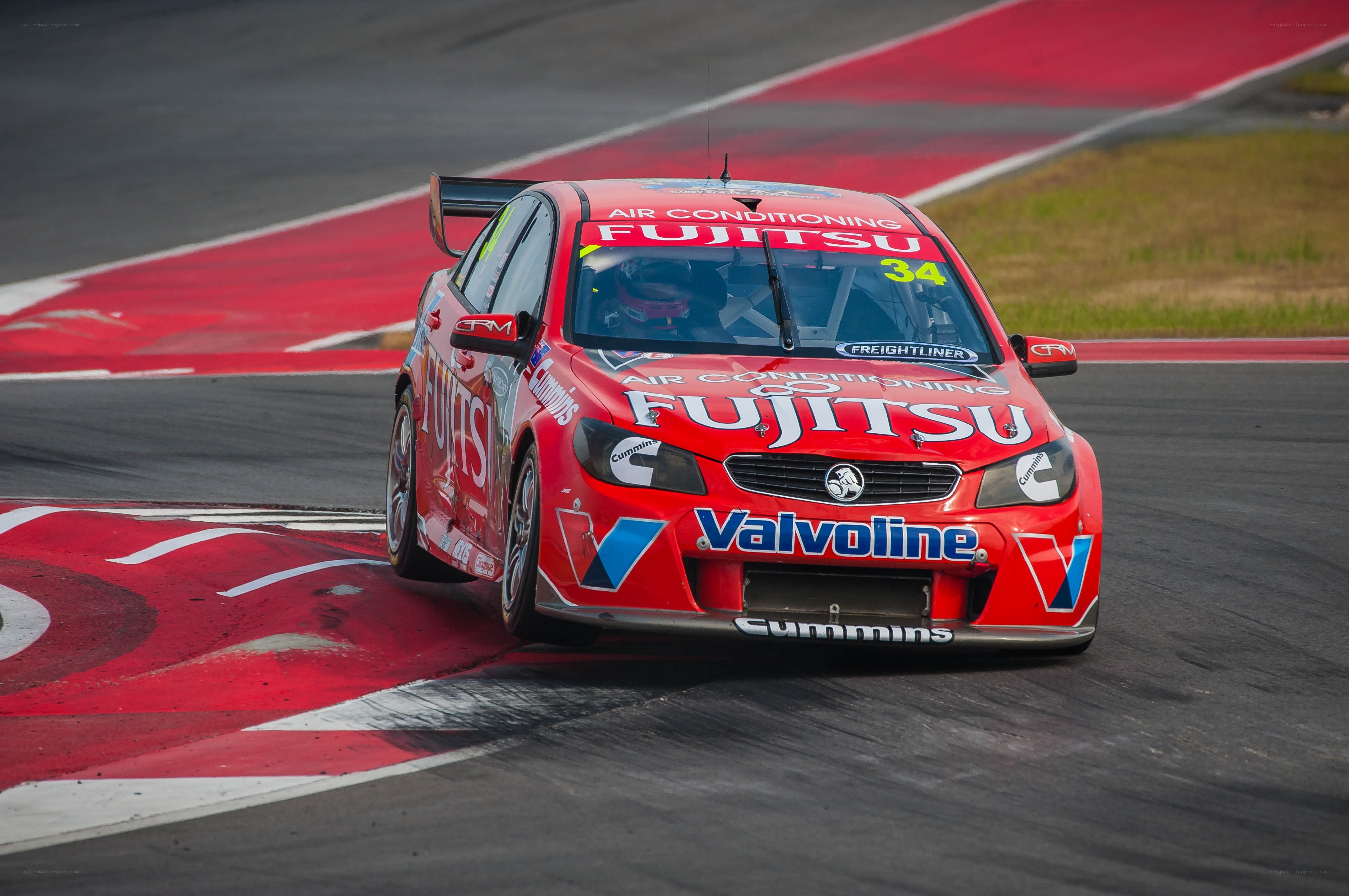 Red race car on track
