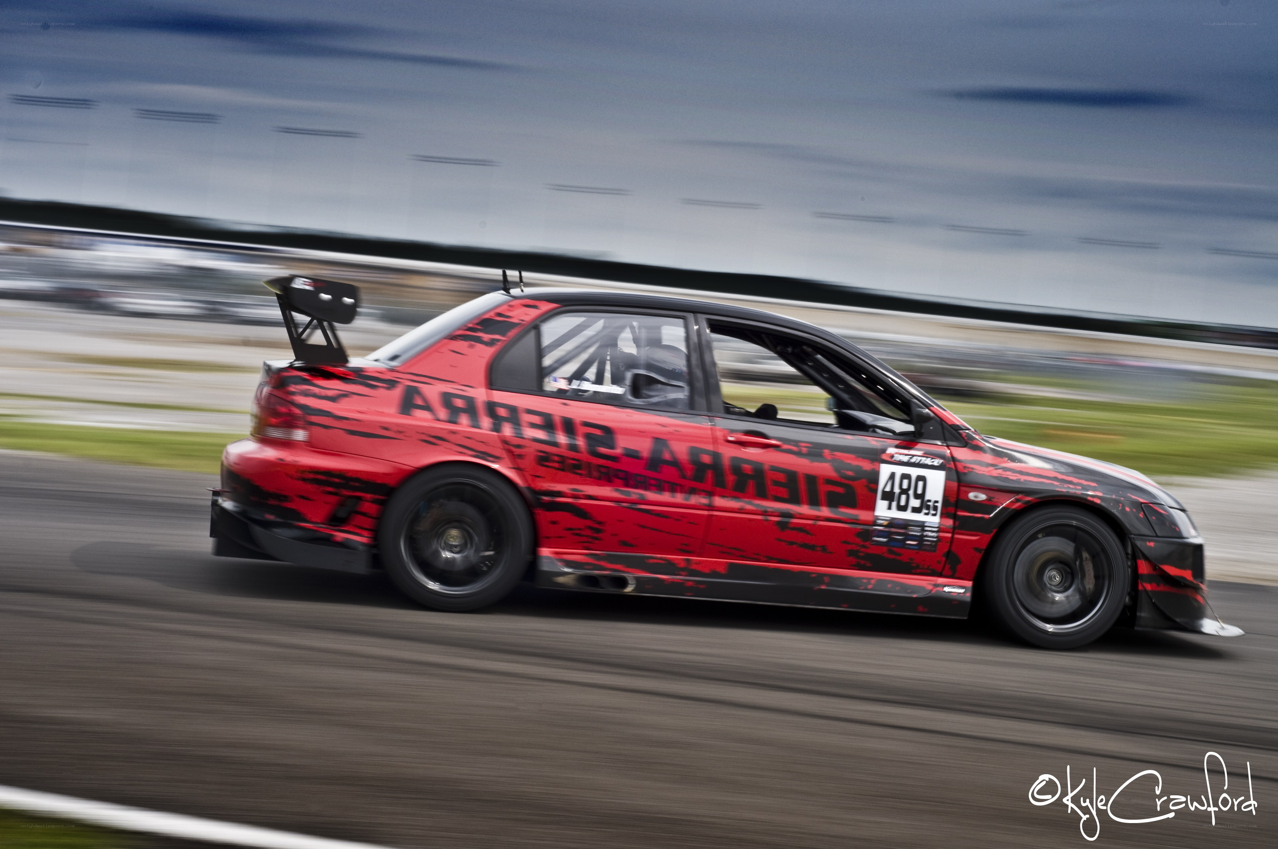 Red race car on track