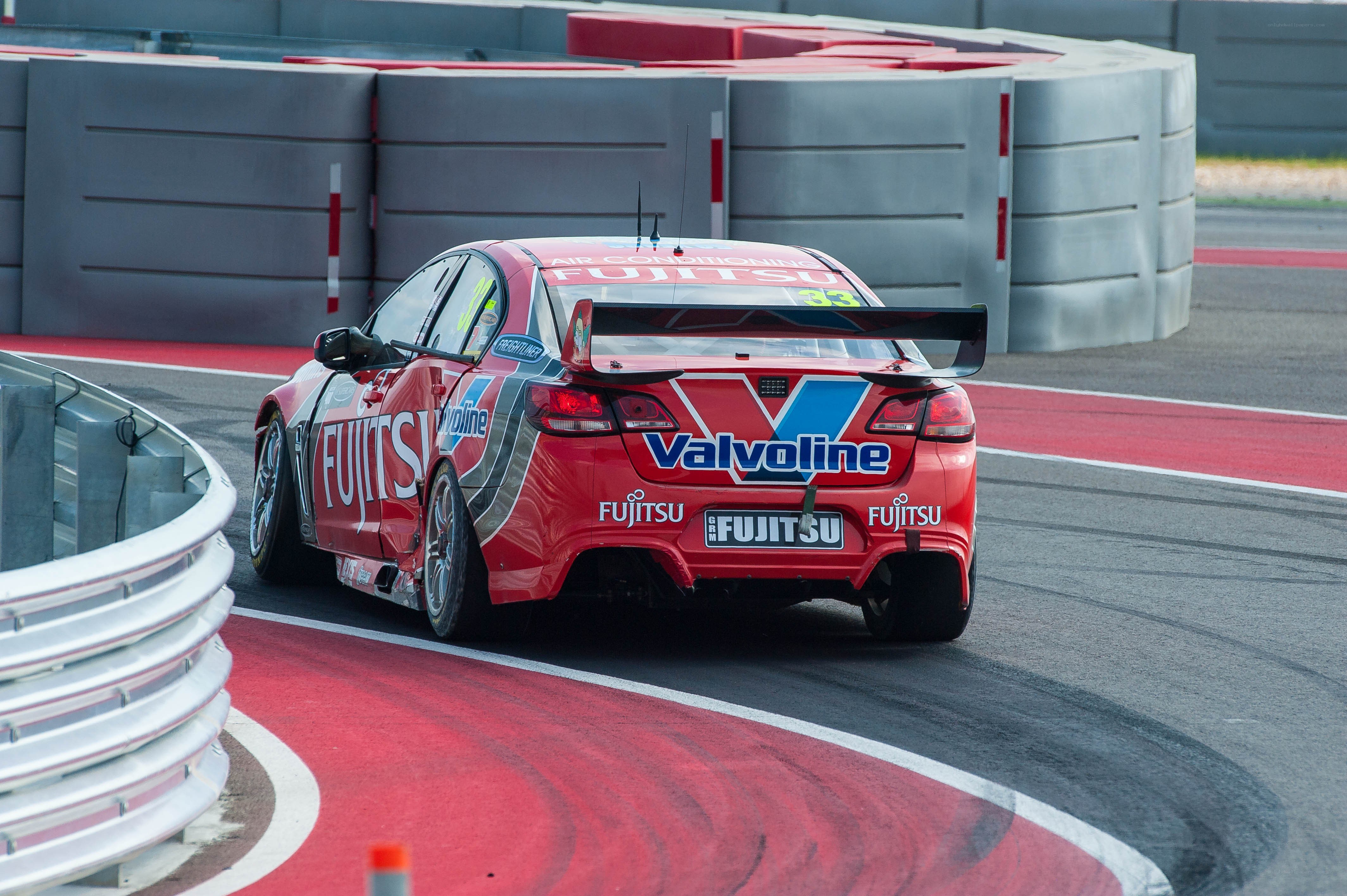 Red race car on track