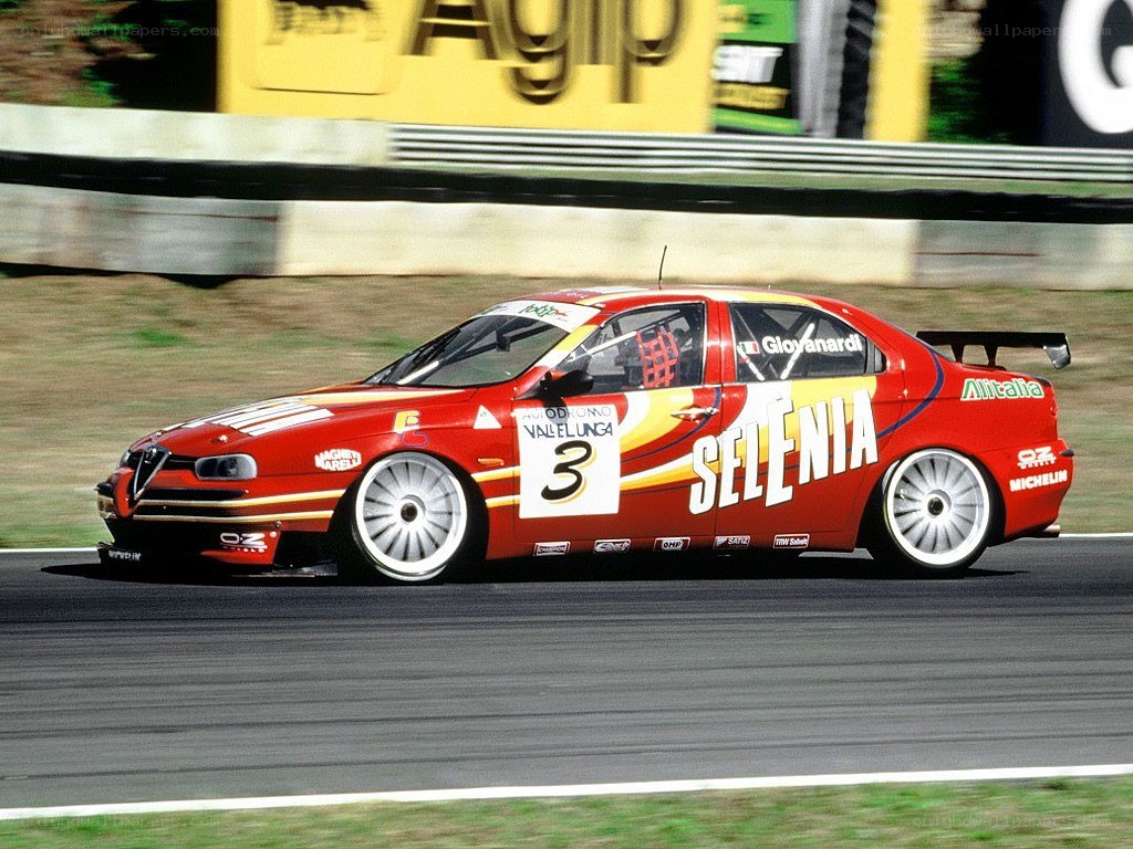 Red race car on track