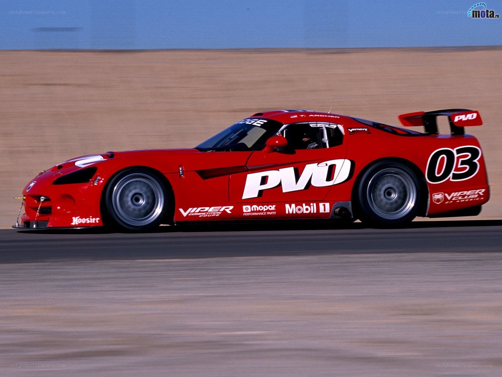 Red race car on track