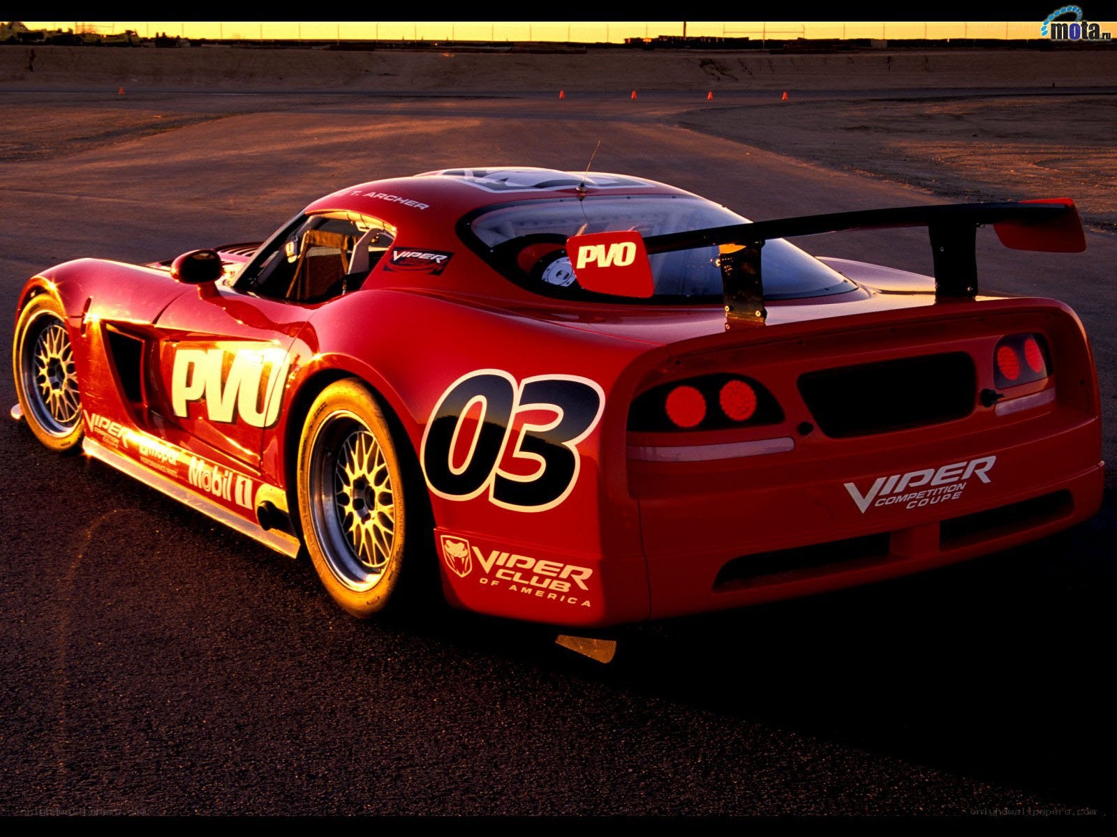Red race car on track