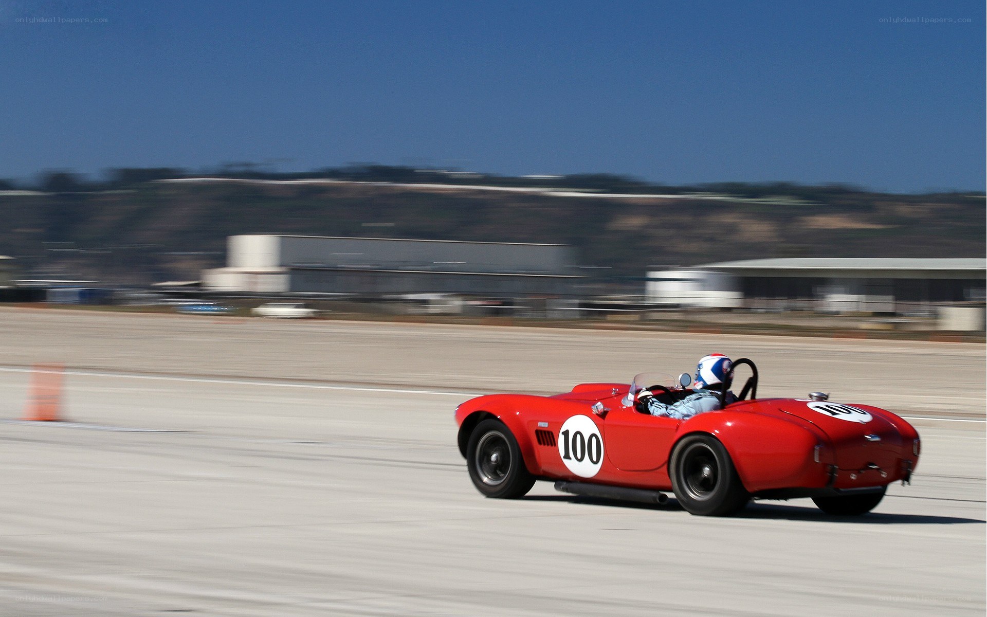 Red race car on track