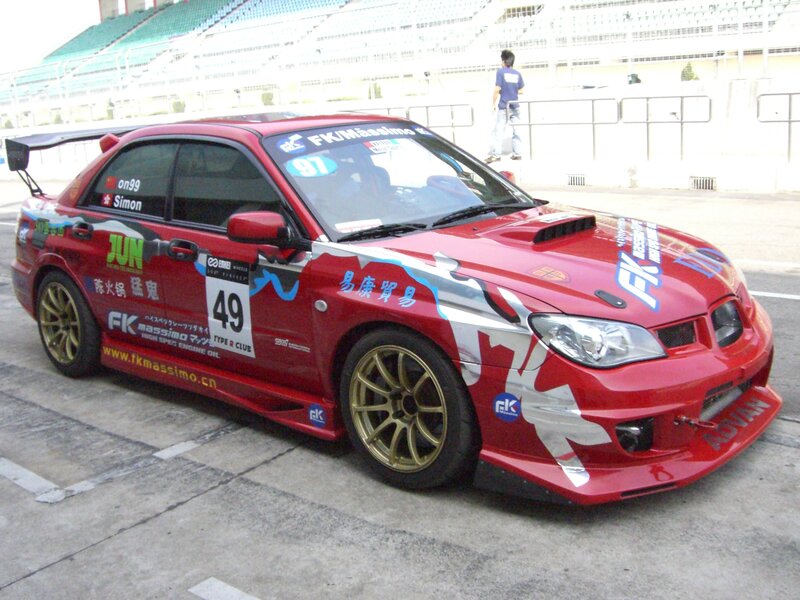 Red race car on track