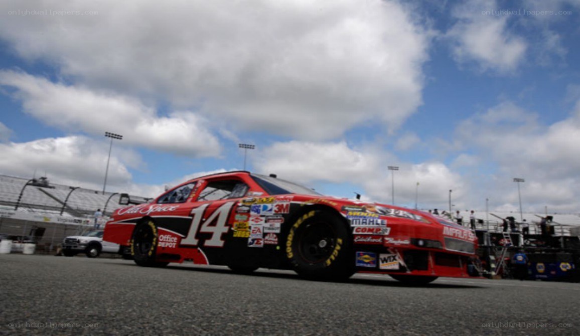 Red race car on track
