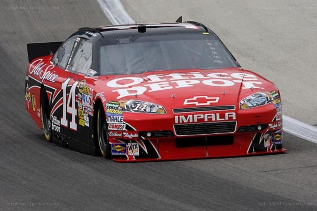 Red race car on track