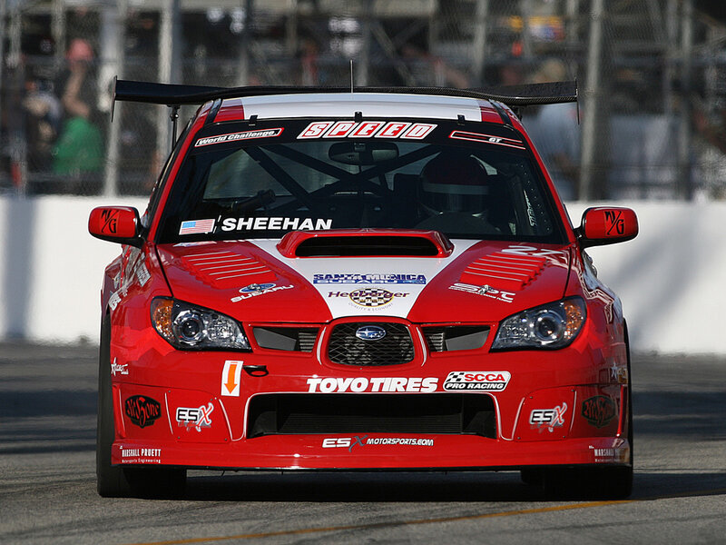 Red race car on track