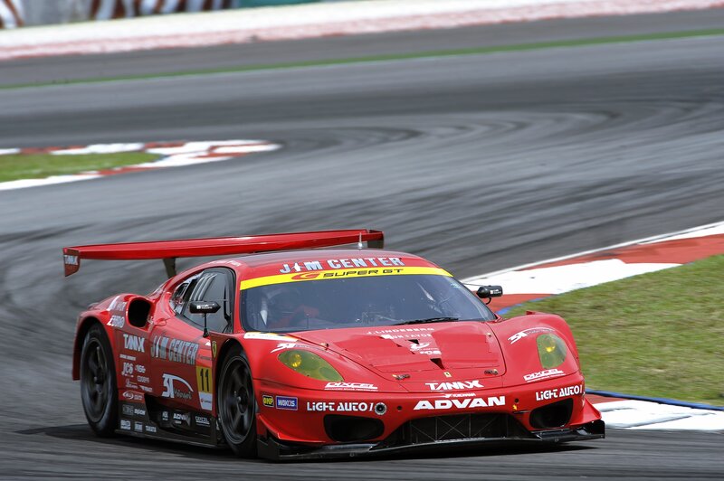 Red race car on track
