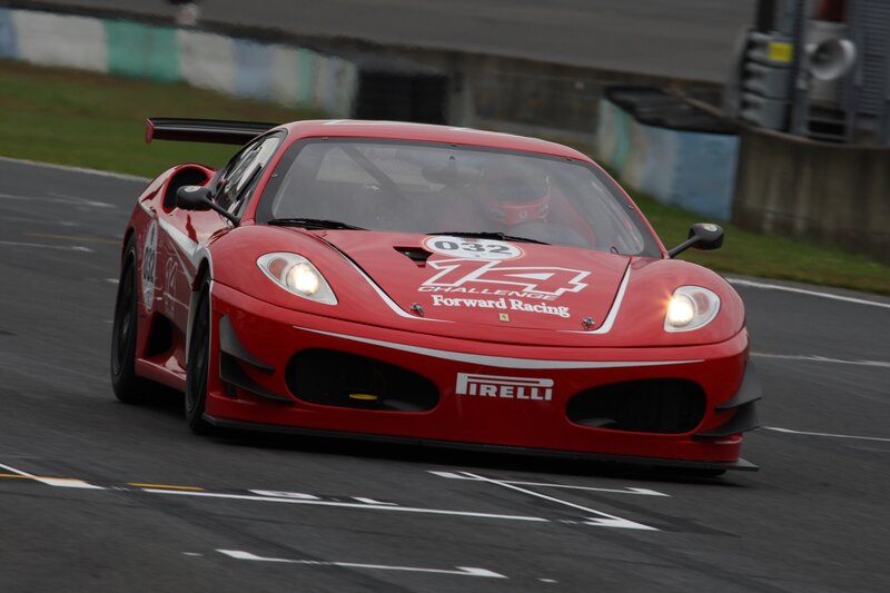 Red race car on track