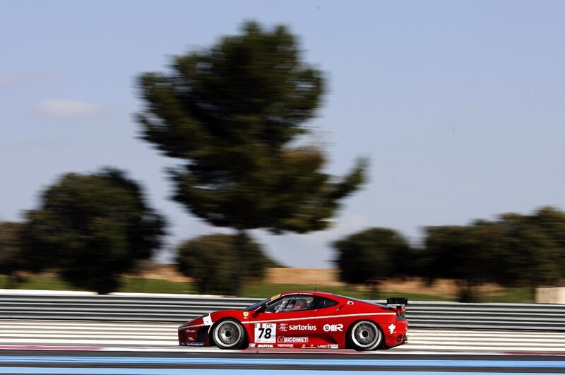 Red race car on track