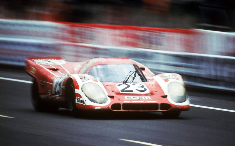 Red race car on track