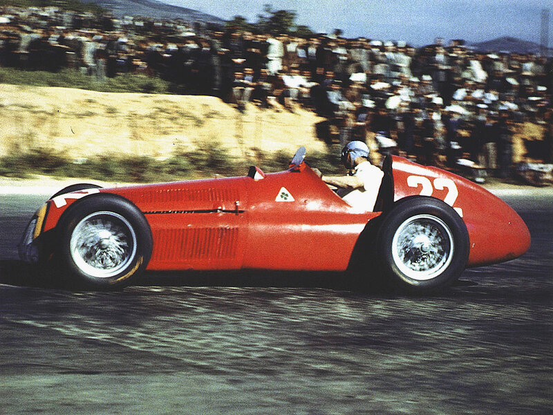Red race car on track