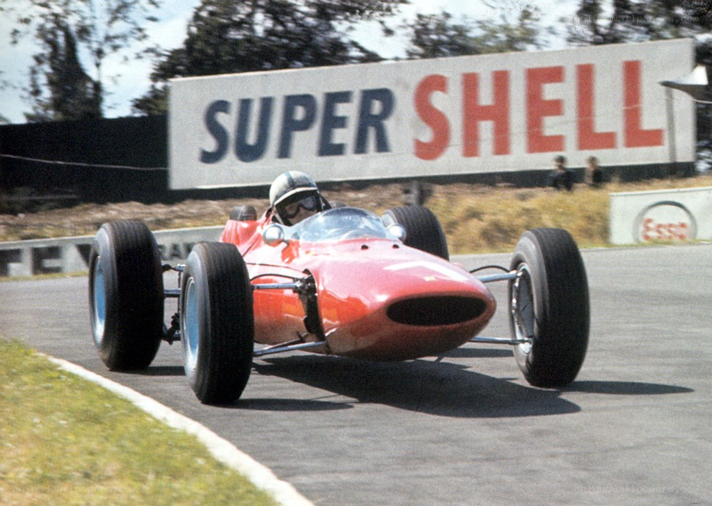 Red race car on track