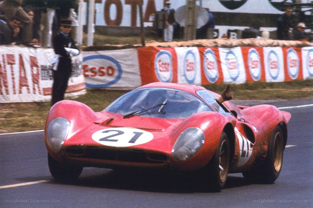 Red race car on track