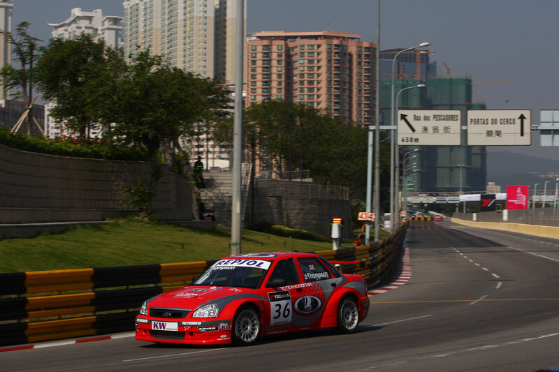 Red race car on track