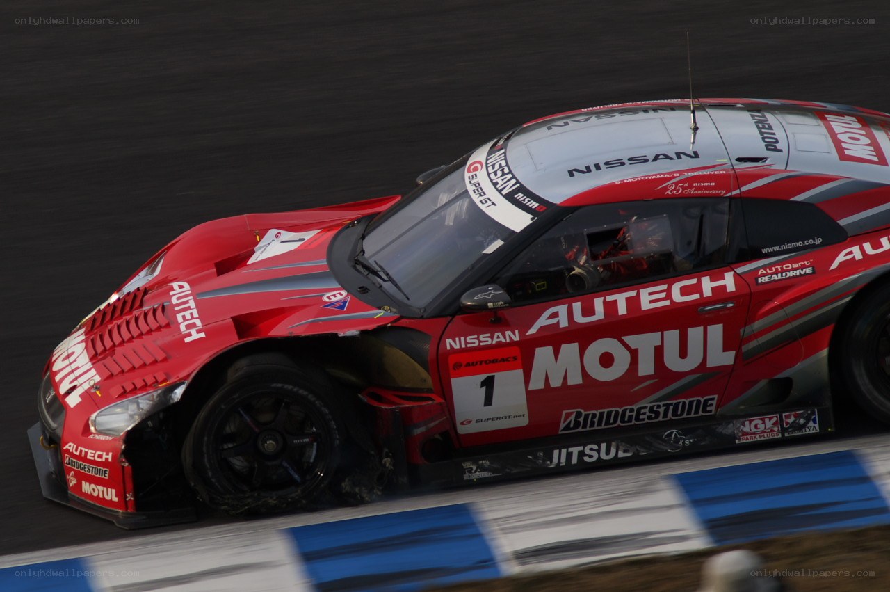 Red race car on track