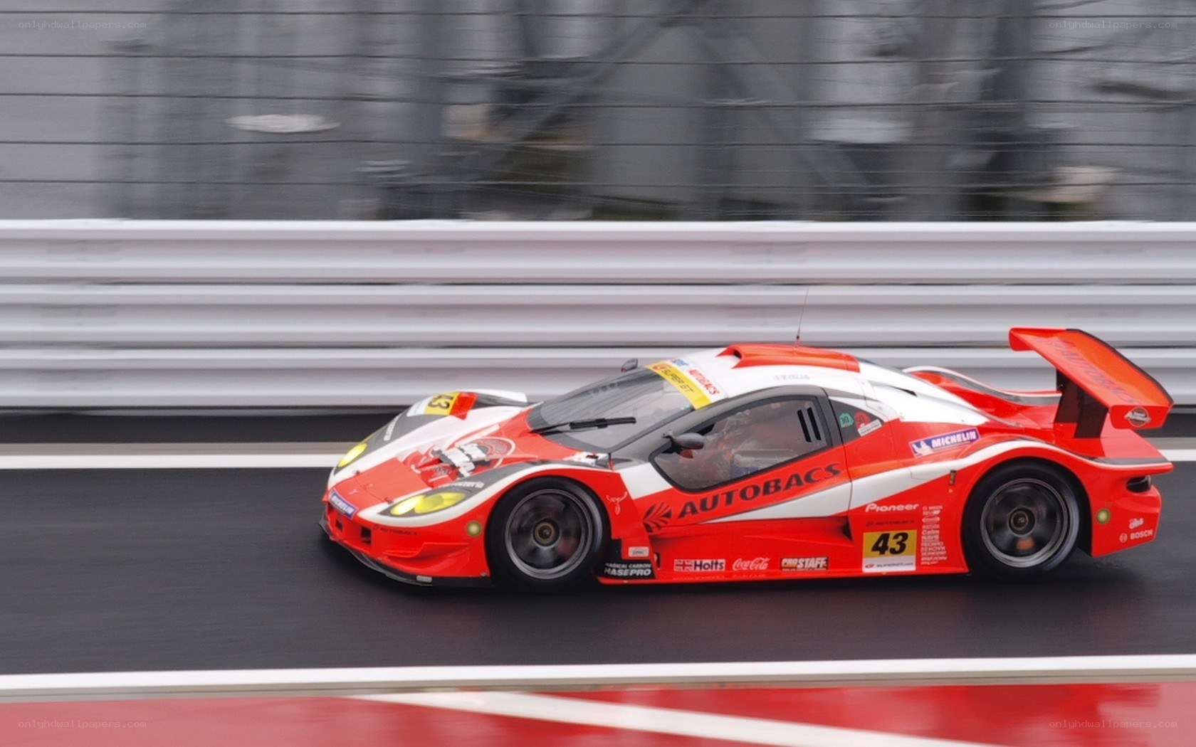 Red race car on track