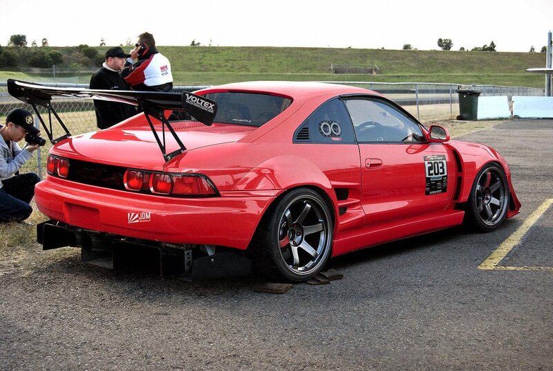 Red race car on track