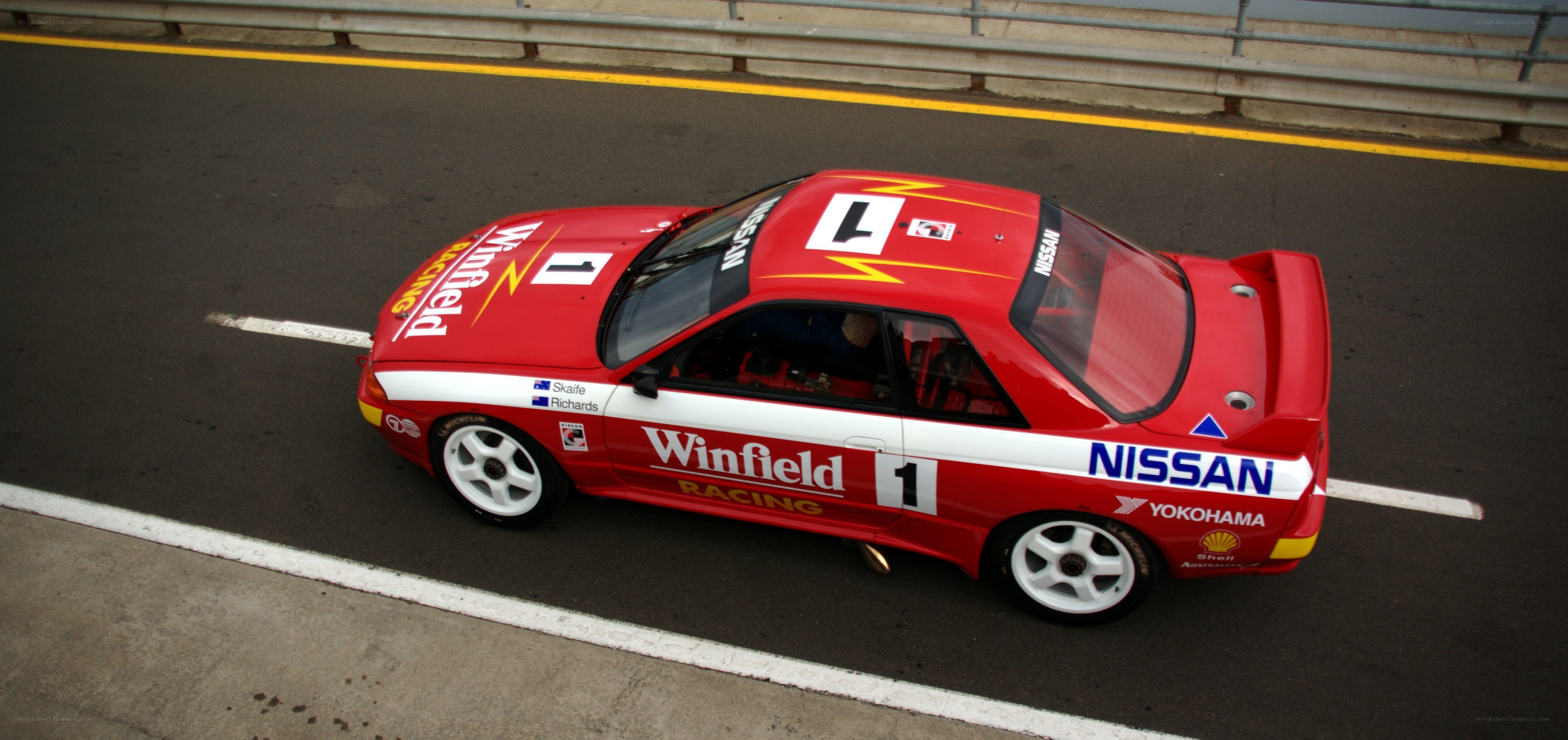 Red race car on track