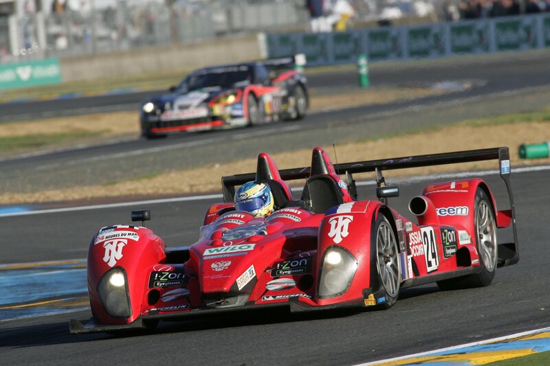 Red race car on track