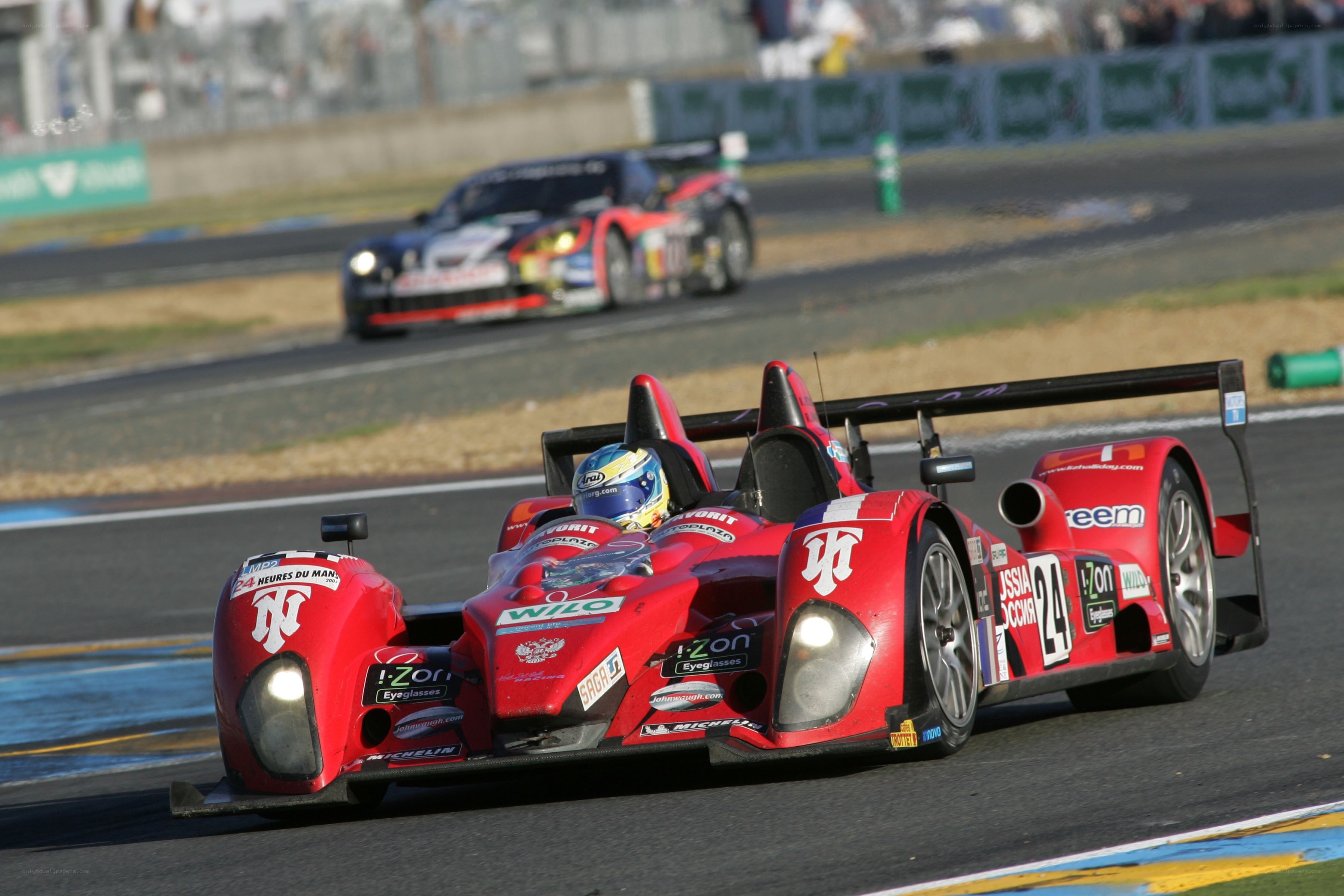 Red race car on track