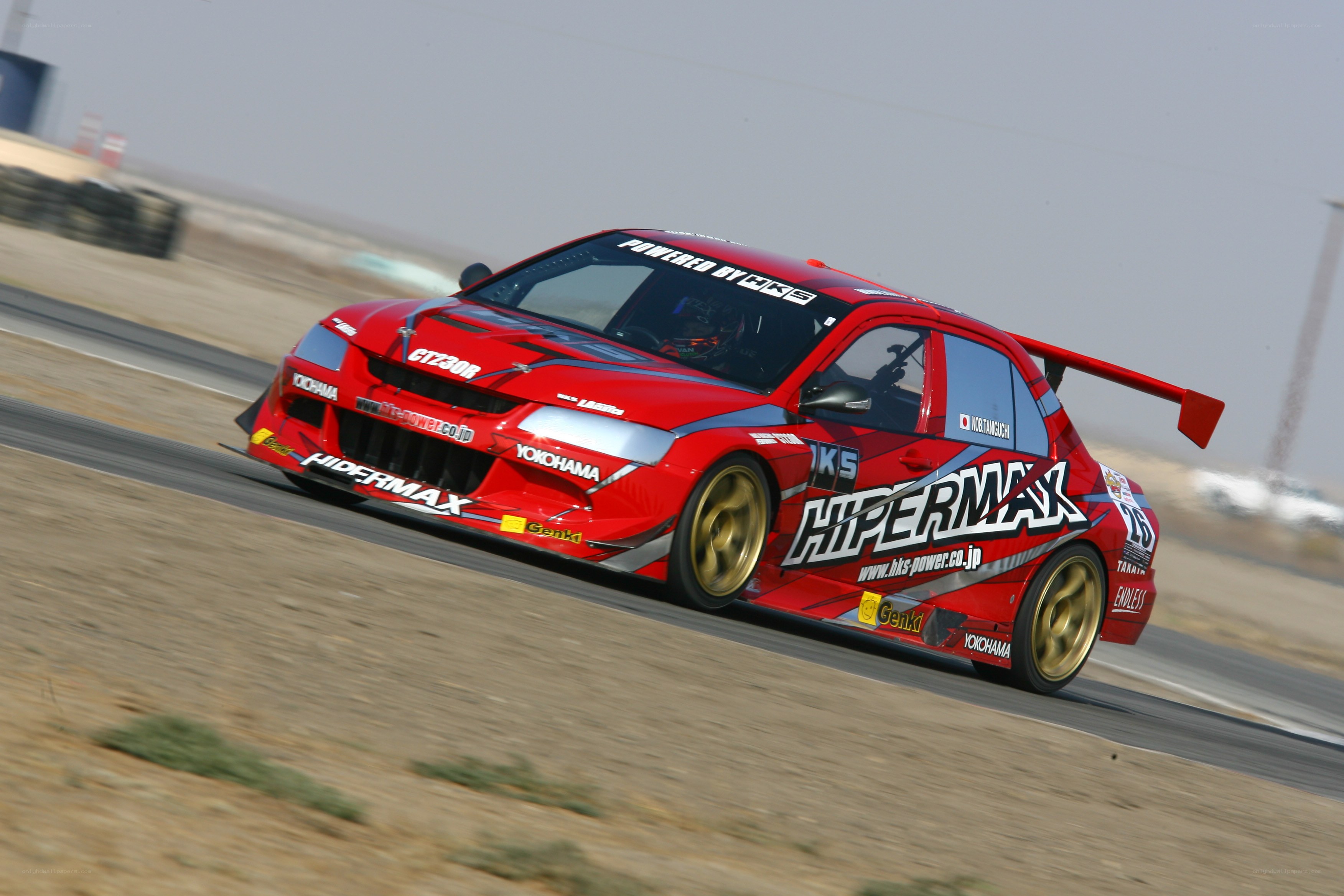 Red race car on track