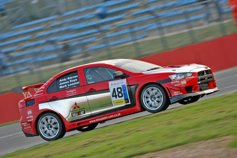 Red race car on track