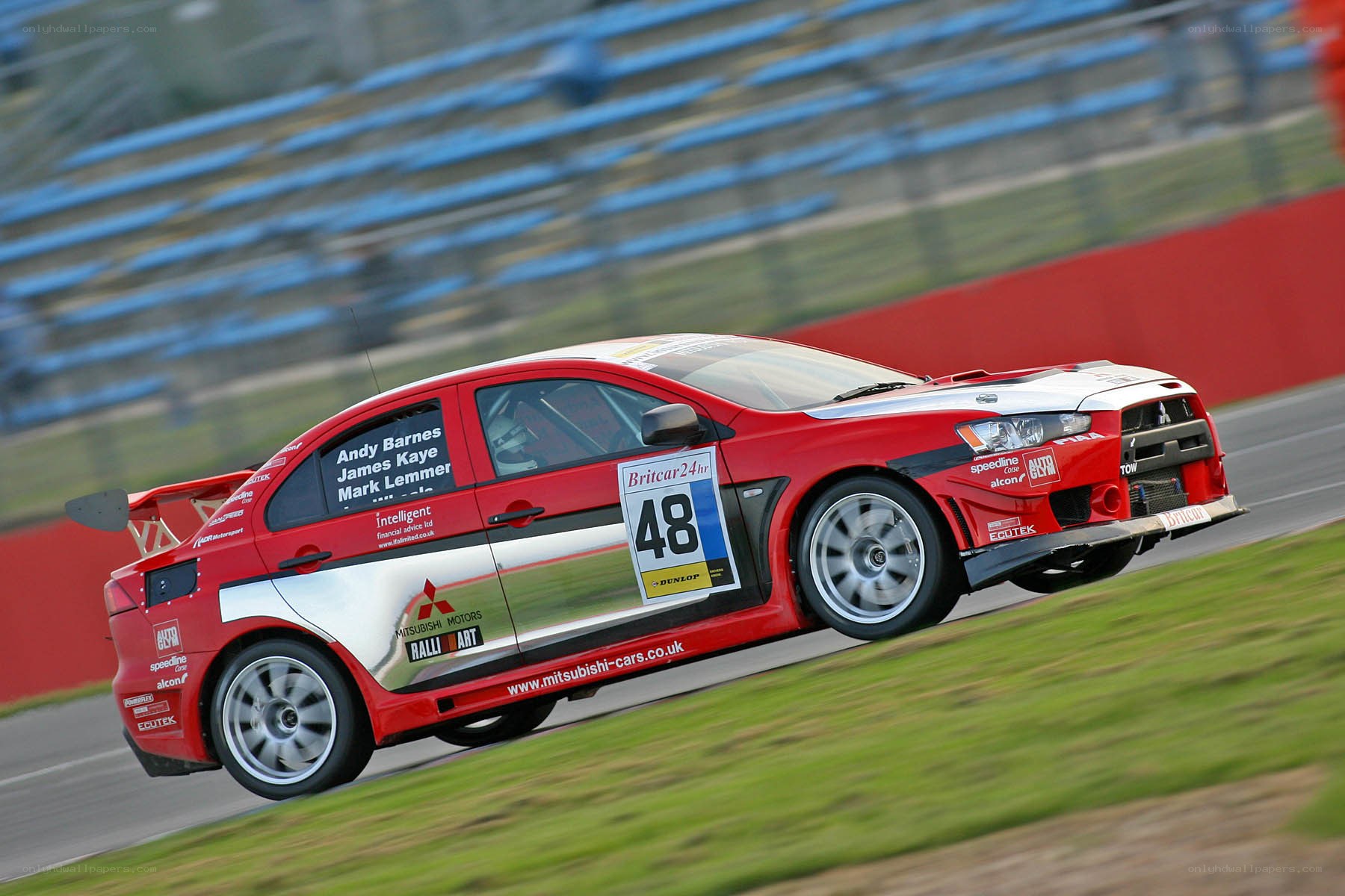 Red race car on track