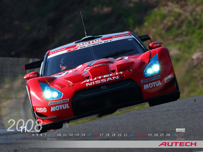 Red race car on track