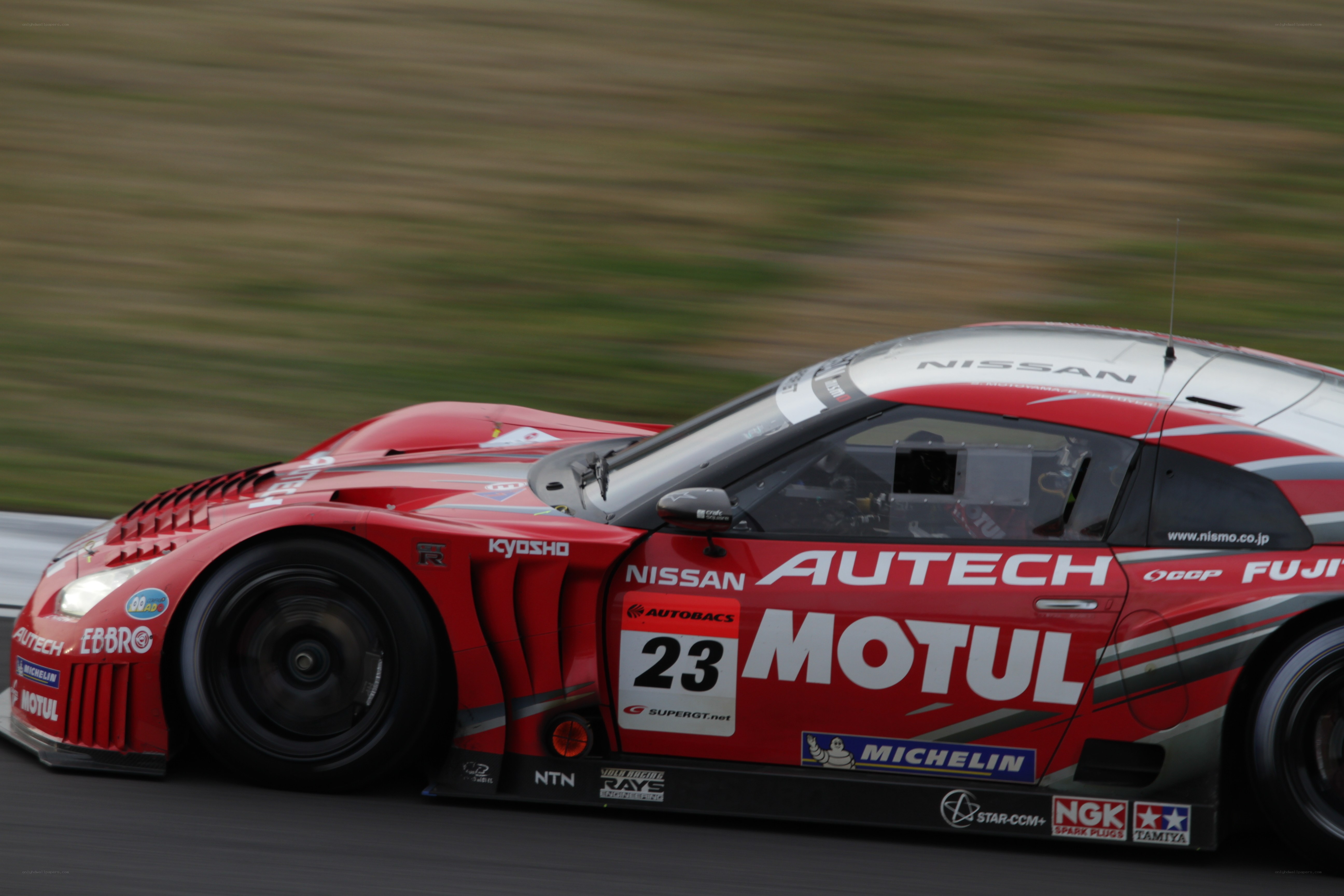 Red race car on track