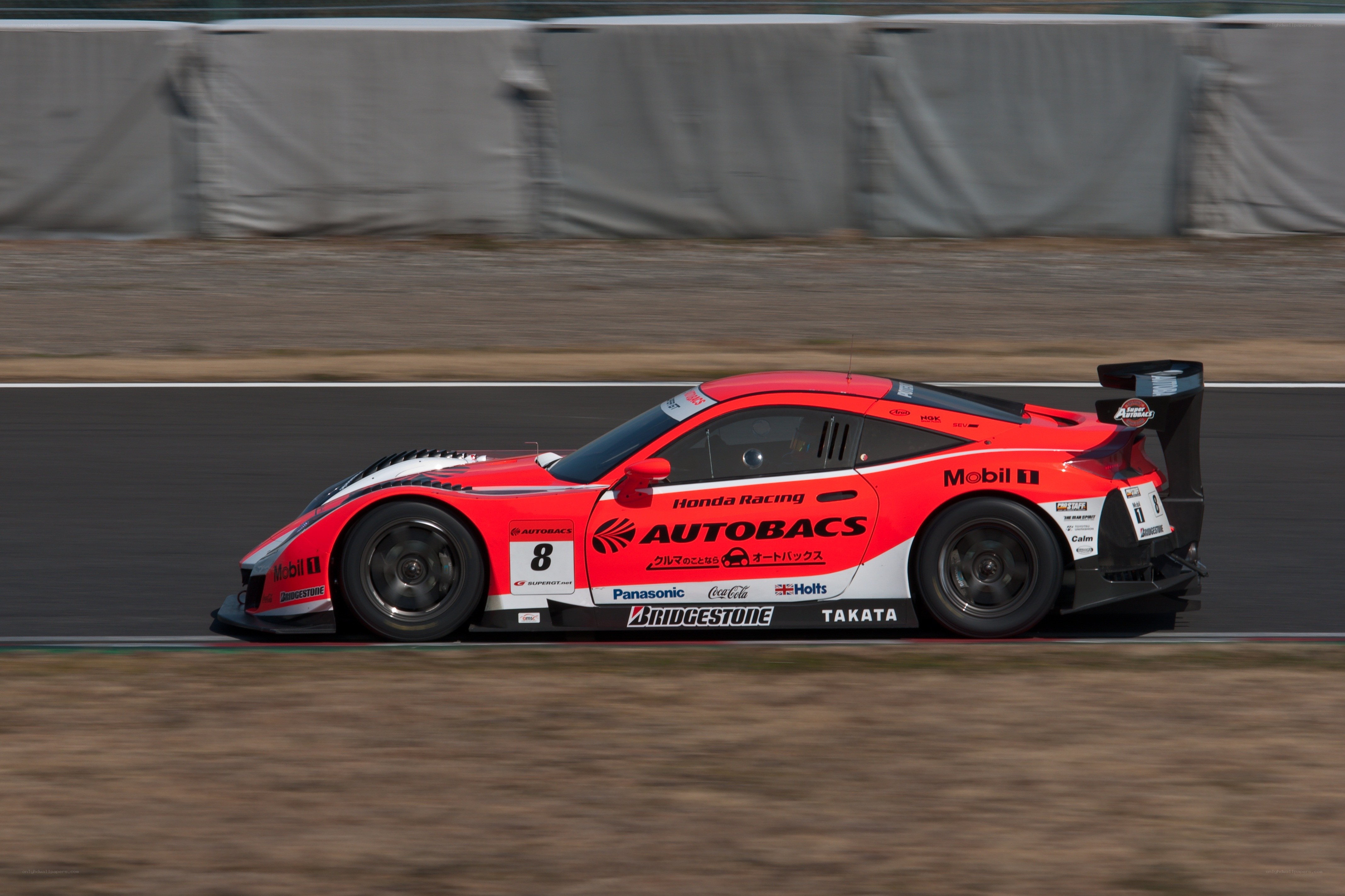 Red race car on track